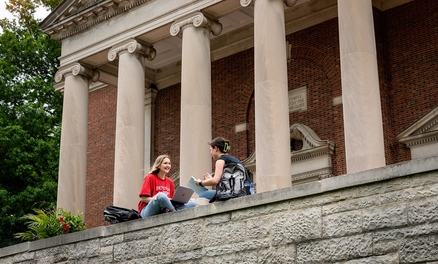 Students sitting outside Swasey Chapel