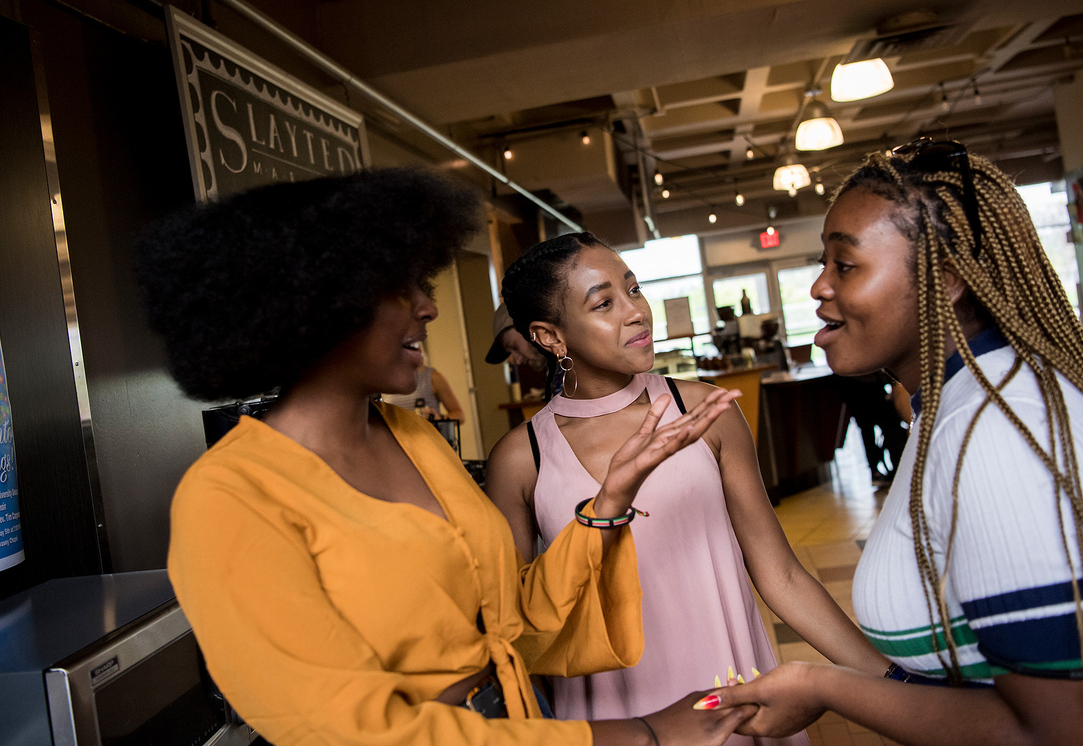 Students chatting at Slayter