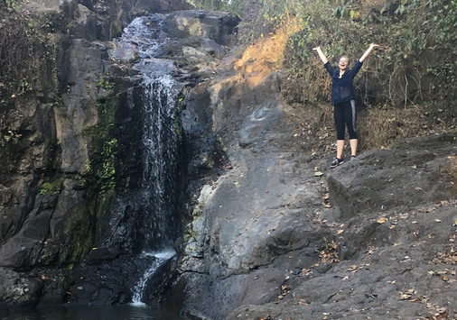 Bailey Greene '18 by waterfall in Cuba