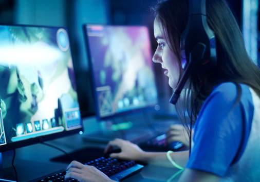 girl gaming on computer