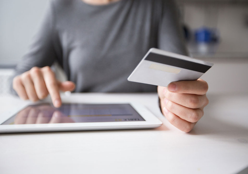 person using a credit card