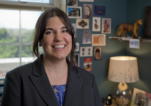 Joanna Tague, smiling in office