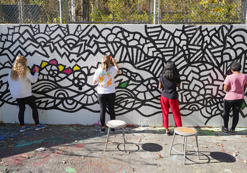 Students creating a mindful graffiti wall