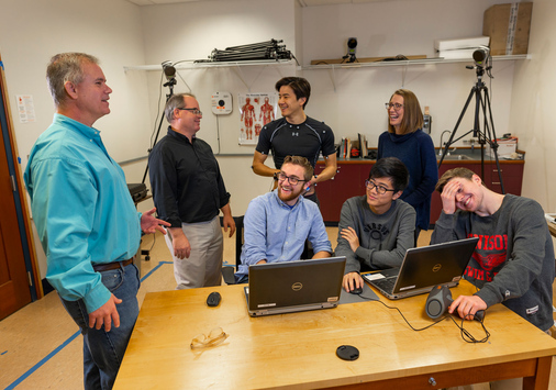 Students review data with Professors