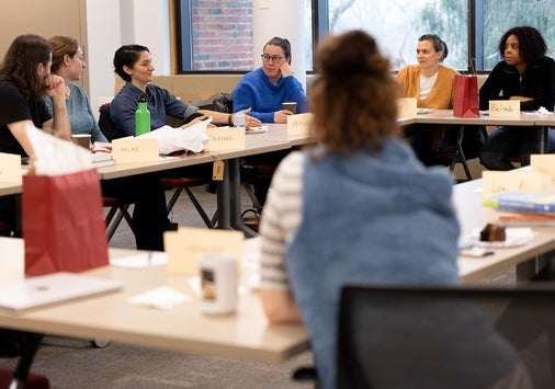 Faculty members sitting together in the classroom