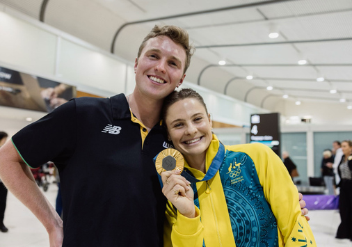James Baker greeted Olympic pole vault champion Nina Kennedy at the airport in Perth, Australia after she returned from Paris. 