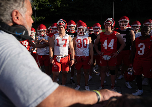 Head Coach talking to football team