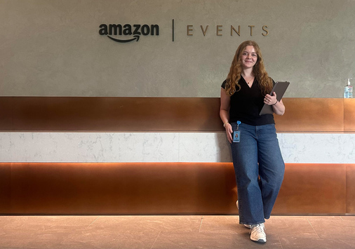 Julia Smith ’28 standing in the lobby of an Amazon office.