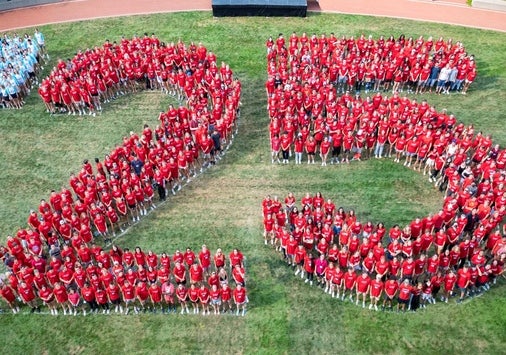 Aerial photo of the Class of 2025 forming a large "'25" on Reese~Shackelford Common