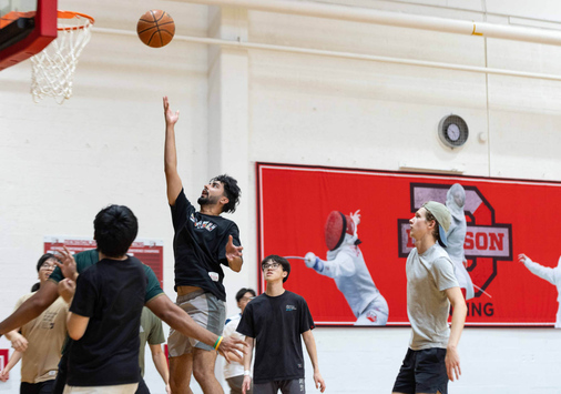 Denison students playing basketball.