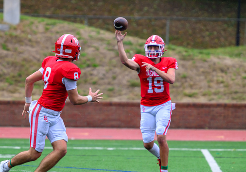 Two football players on a football field.