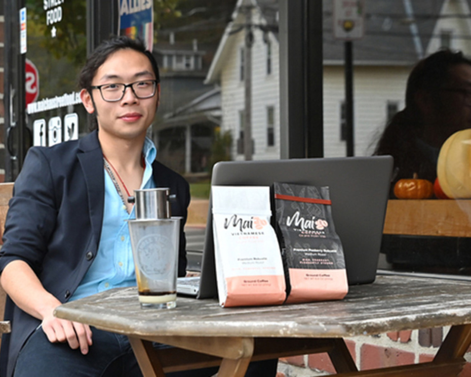 Mai Coffee start up owner Alan Phung '22 outside restaurant Mai Chau