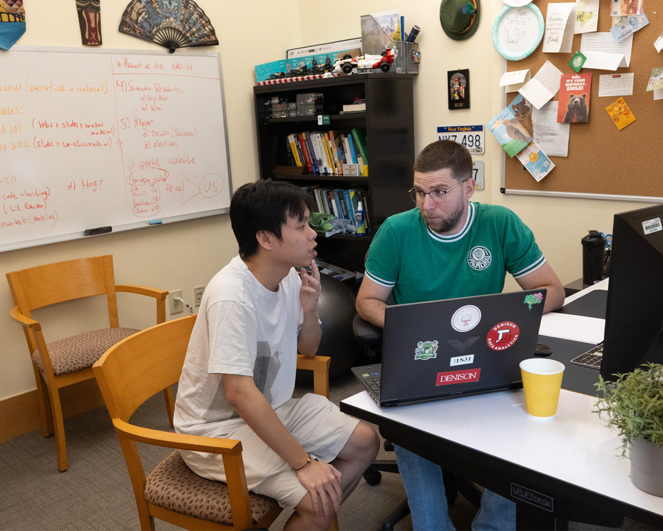 Duy Anh Nguyen ’27 and Alexandre Scarcioffolo meeting in a faculty office.