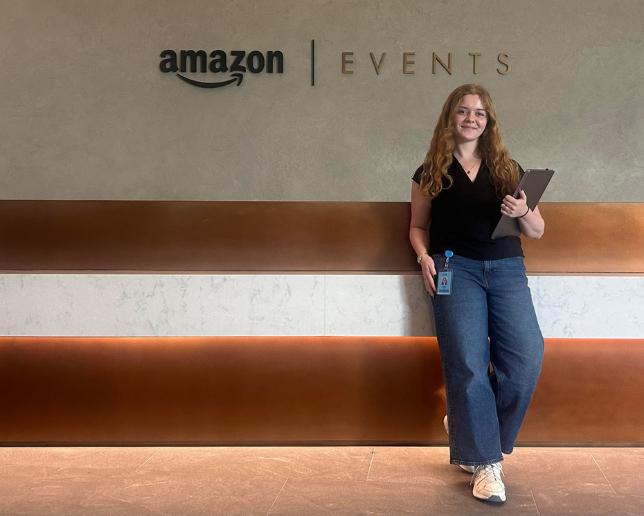 Julia Smith ’28 standing in the lobby of an Amazon office.
