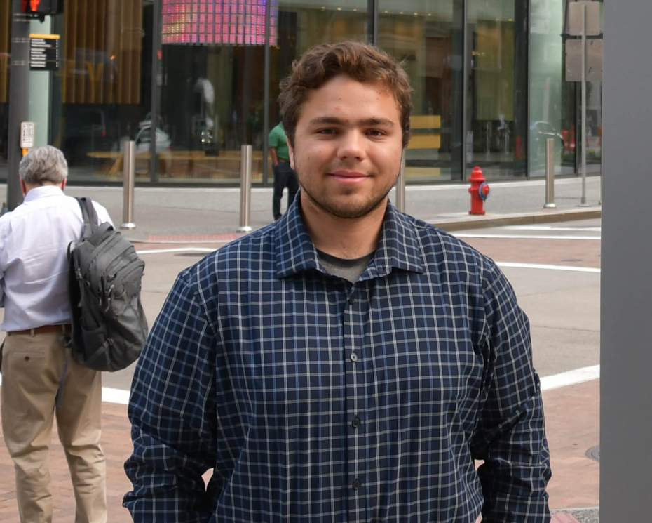 Cole Shegan Siniawski ’26 standing outside the PNC building in downtown Pittsburgh.