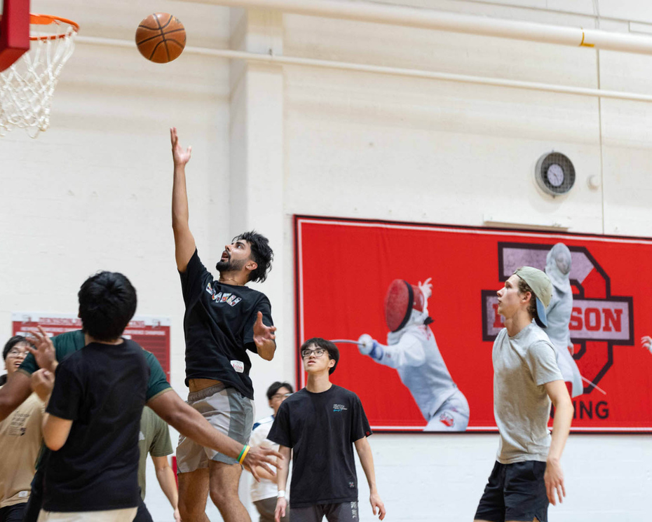 Denison students playing basketball.