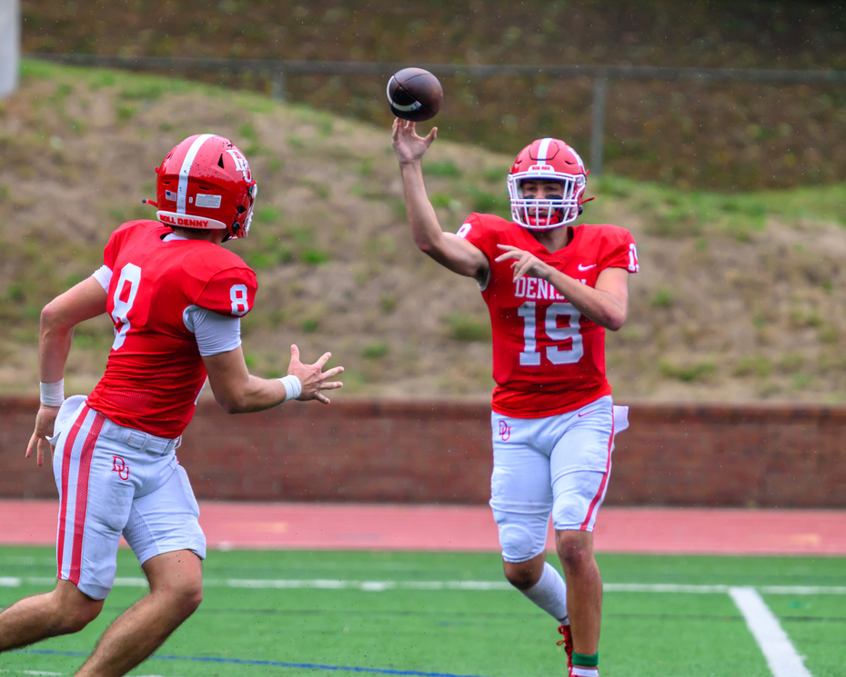 Two football players on a football field.