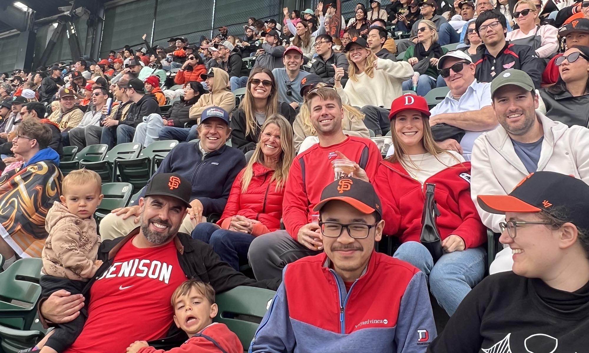 Denison alumni in the stands at an MLB baseball game.