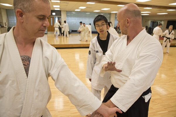 Winters and Tangeman demonstrate correct positioning for a seminar student.