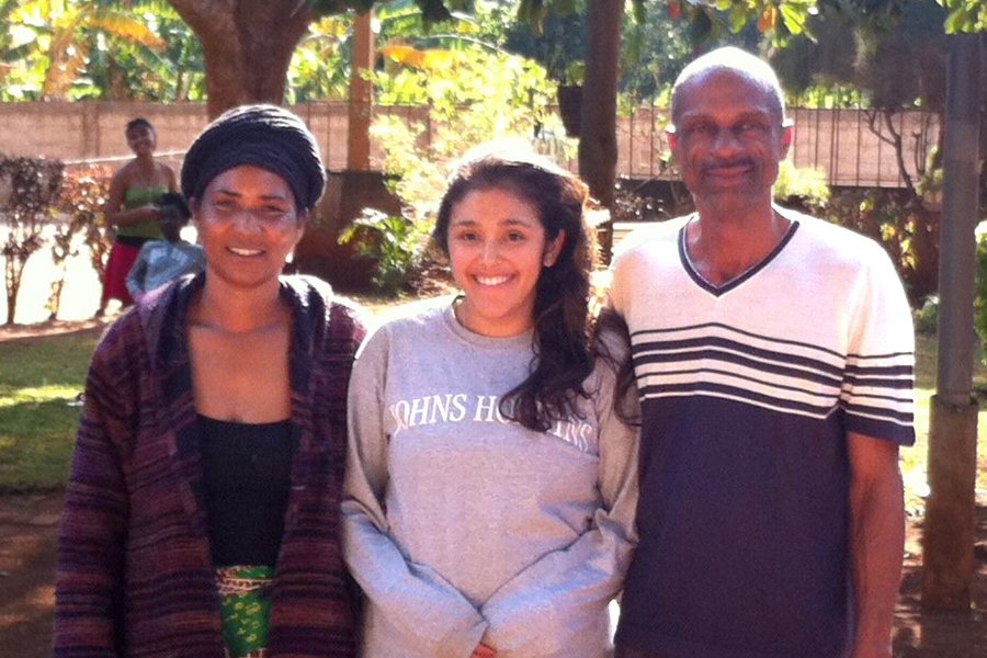 Adela Hoffman '10 with her Peace Corps homestay parents in Mozambique.