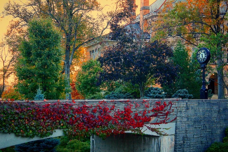 The campus footbridge with Doane Hall in the background in the fall