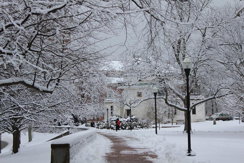 Chapel Walk in the winter snow with Swasey Observatory in the background