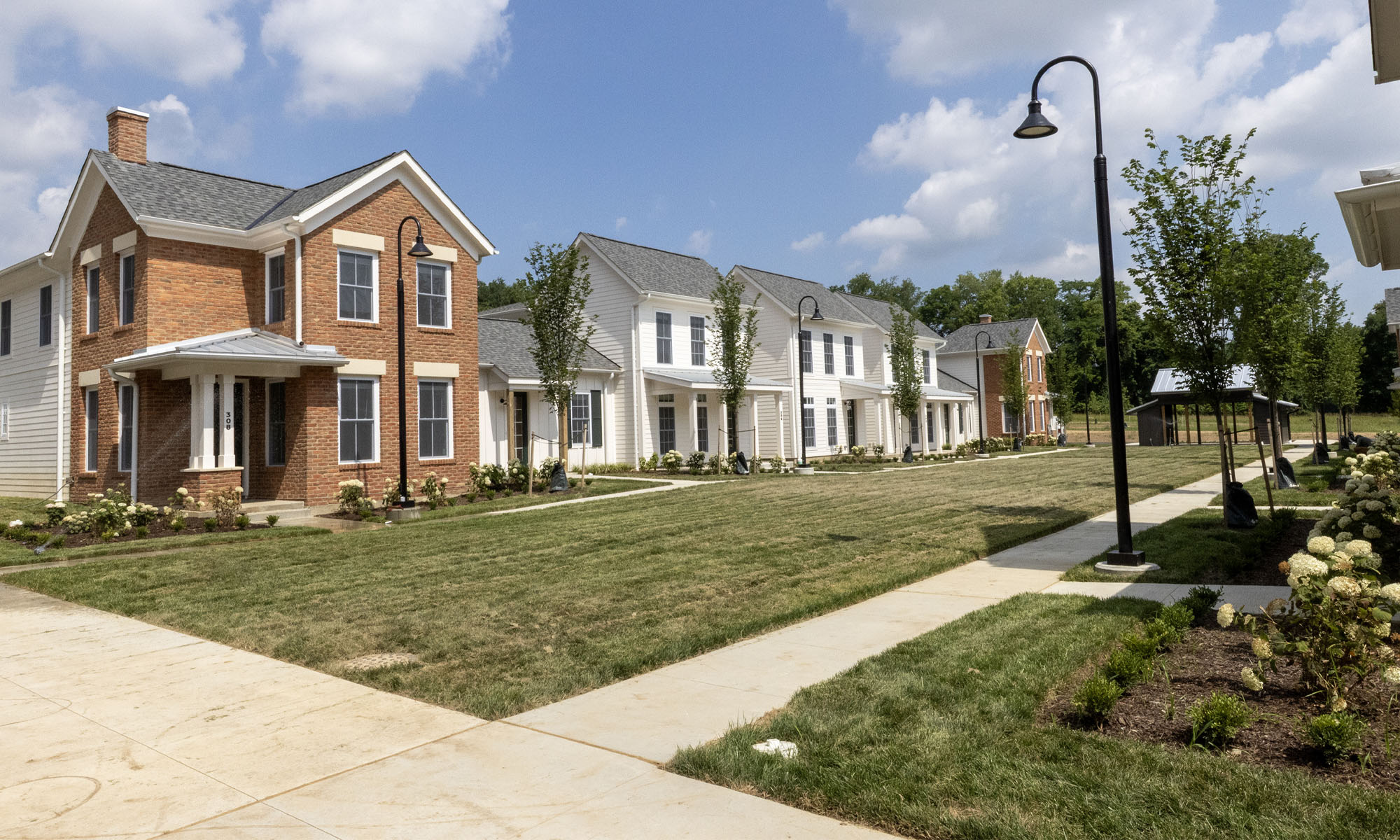 A wide view of several homes in the Hillside Drive Apartments community.