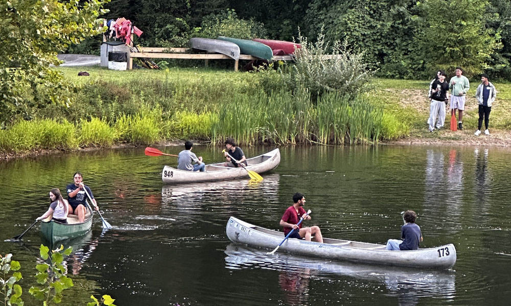 Enjoying an afternoon in canoes on the lake.