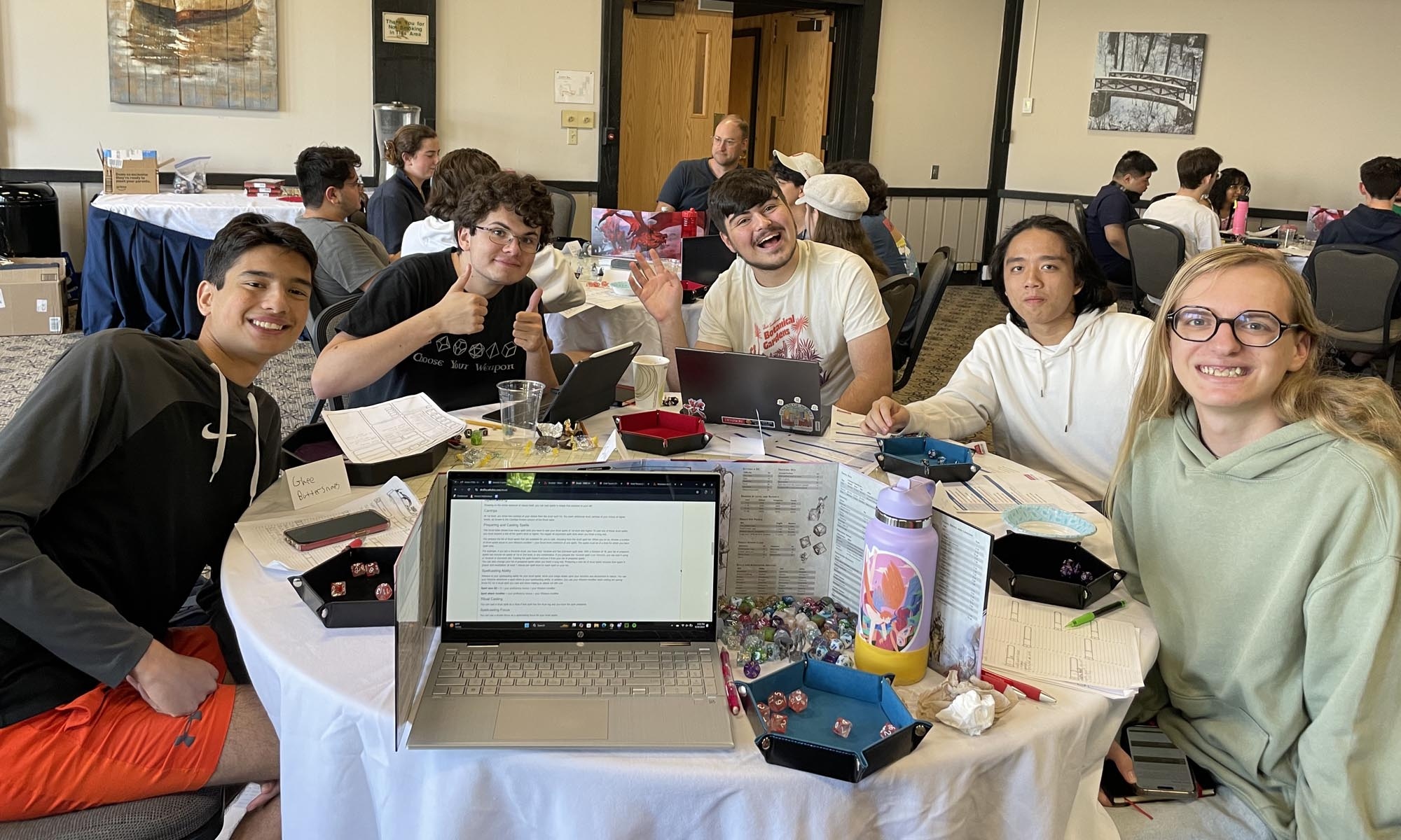 Table-top gamers pause their campaign for a quick photo.