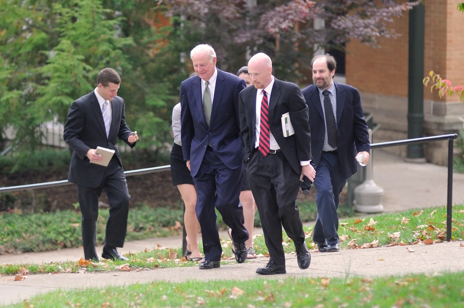 James A. Baker III walks across campus