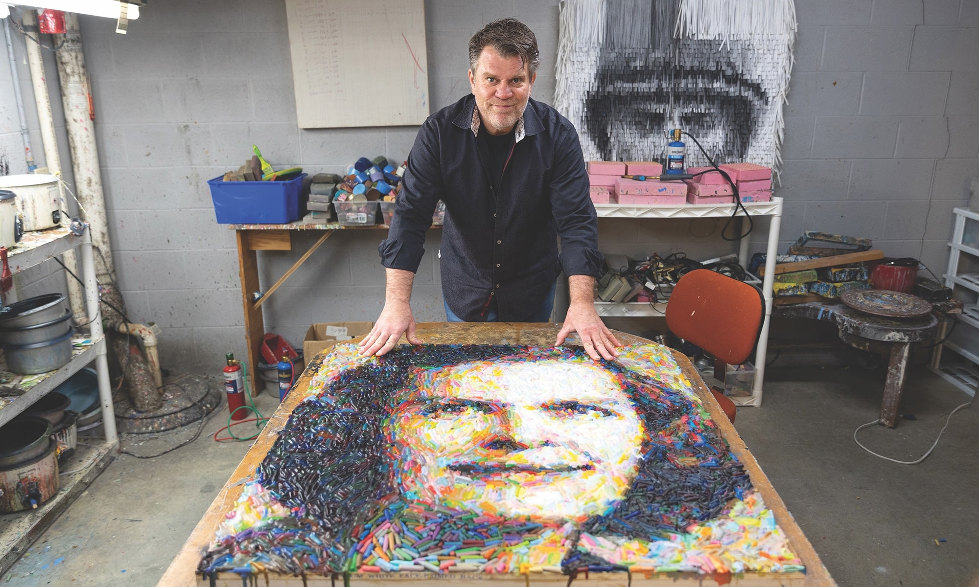 Christian Faur displays a photo-realistic portrait of American mathematician Julia Robinson made from crayons. 