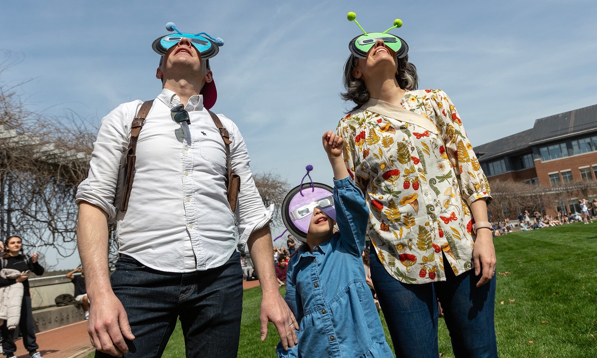 Family watching the solar eclipse