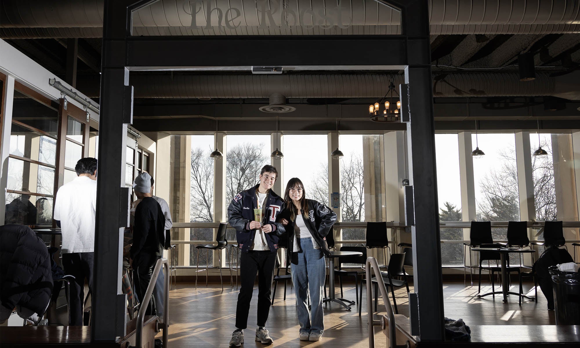 Two students pose for a photo in the student union.