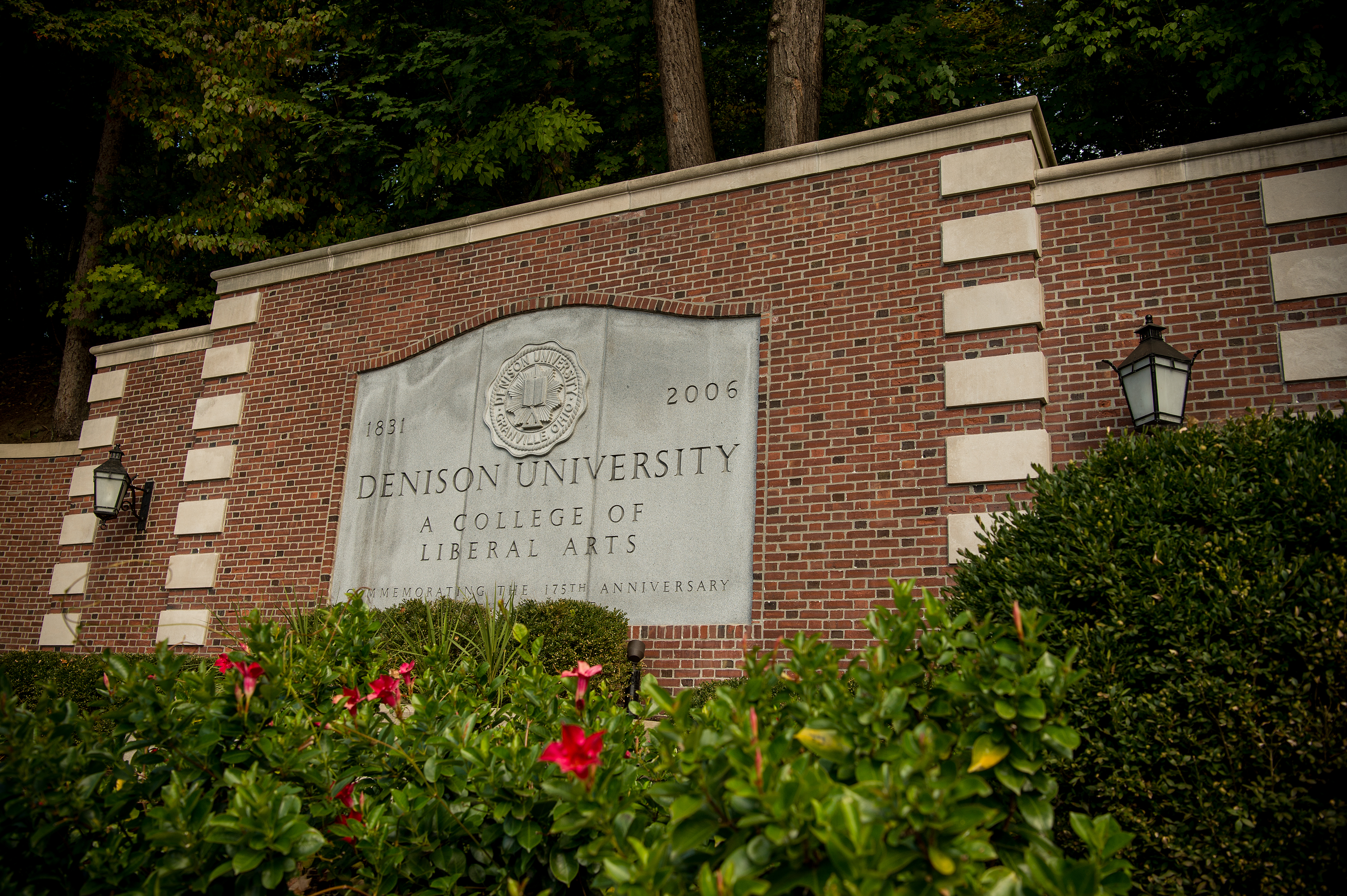 Presidents' Drive sign at the entrance to campus reads "Denison University."