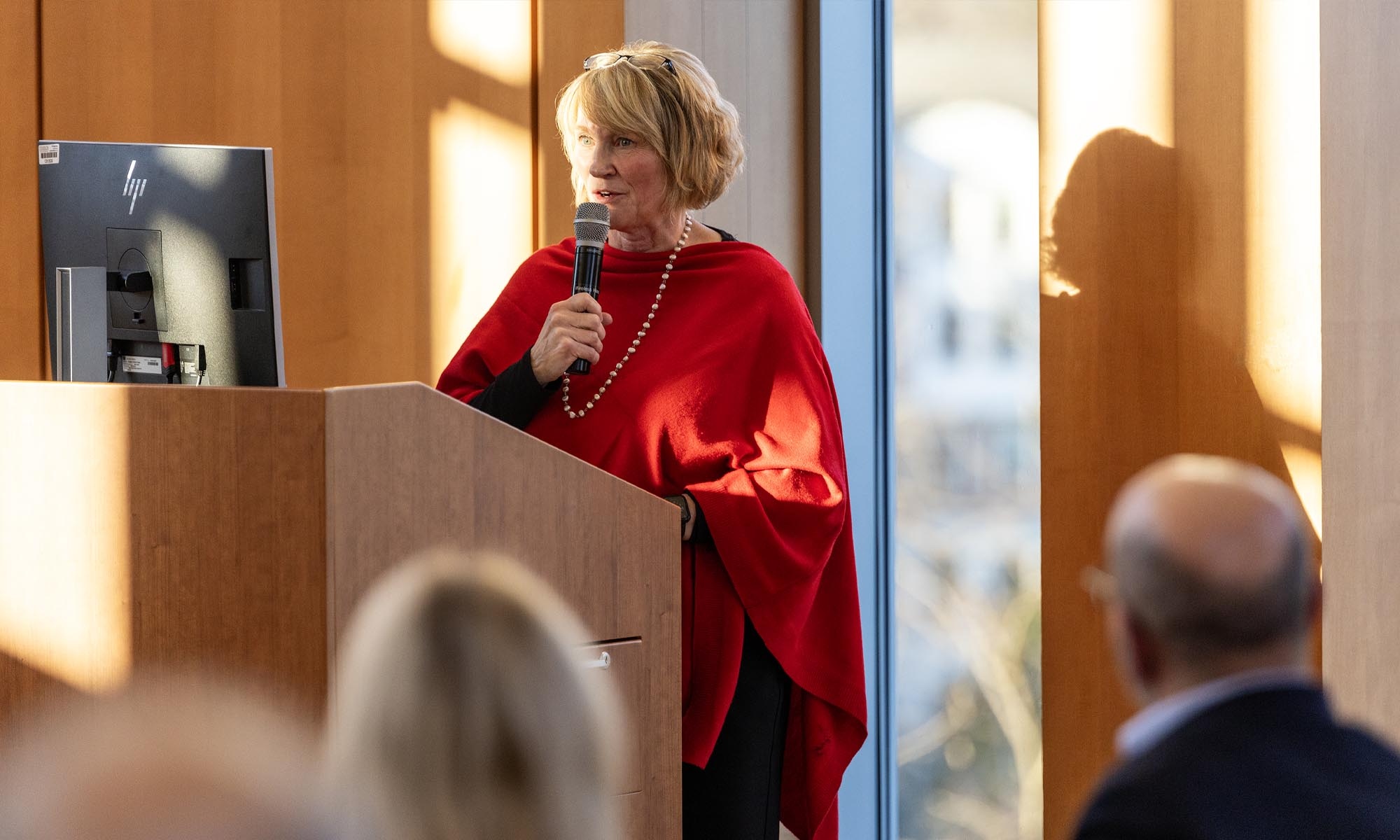 Speaker at the podium at the groundbreaking reception.
