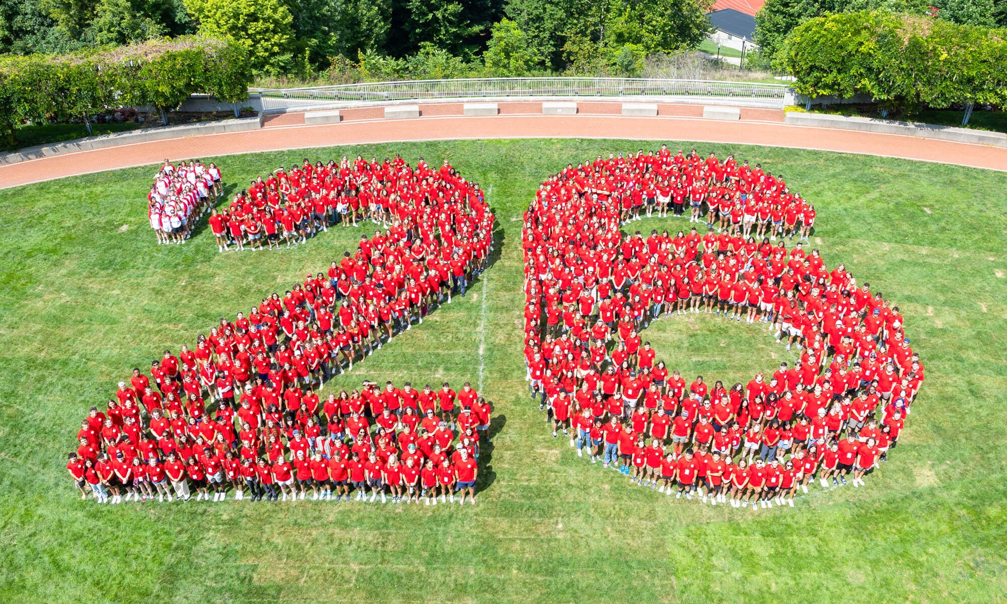 Aerial photo of the Class of 2026 forming a large "'26" on Reese~Shackelford Common