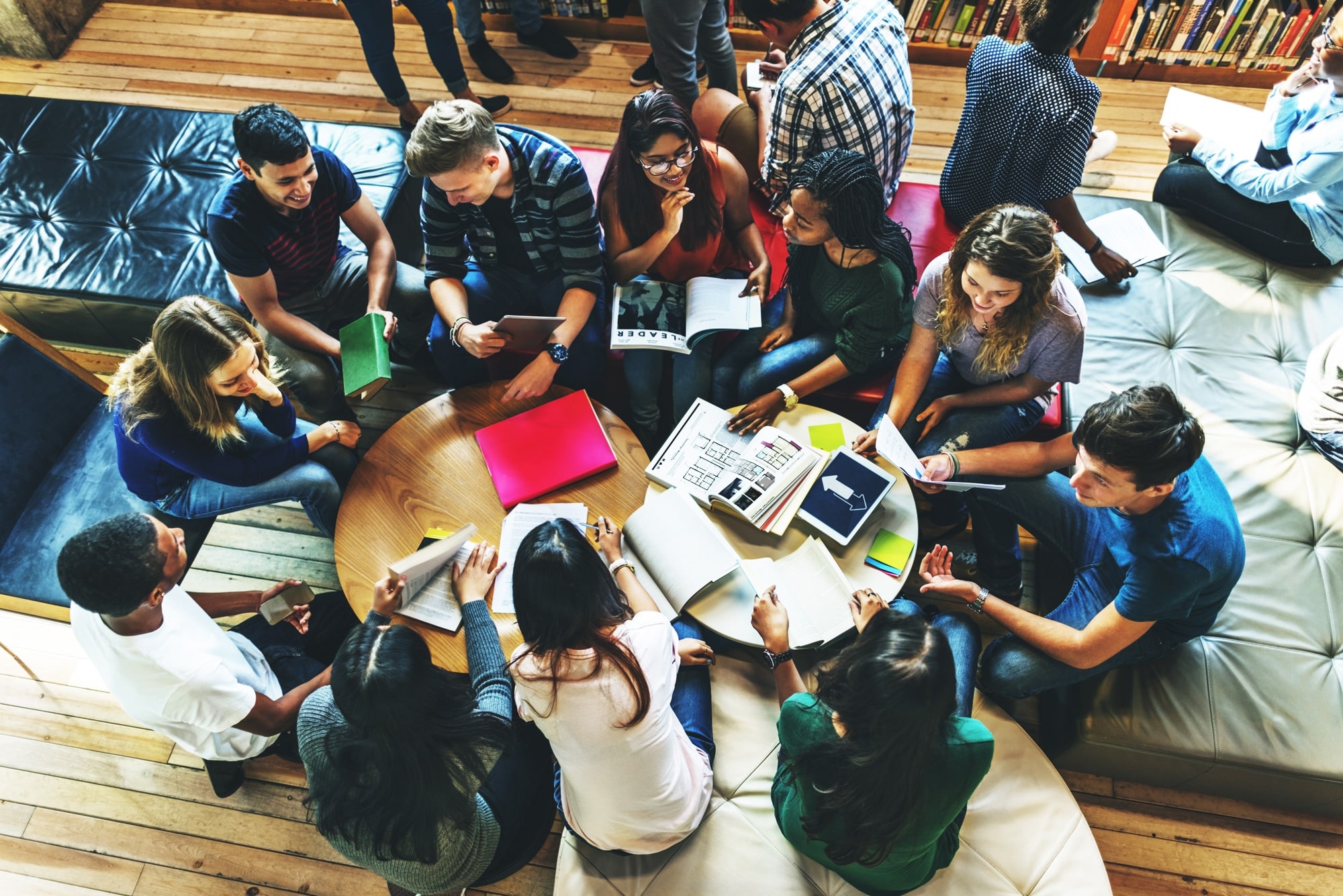 students around a table having a discussion