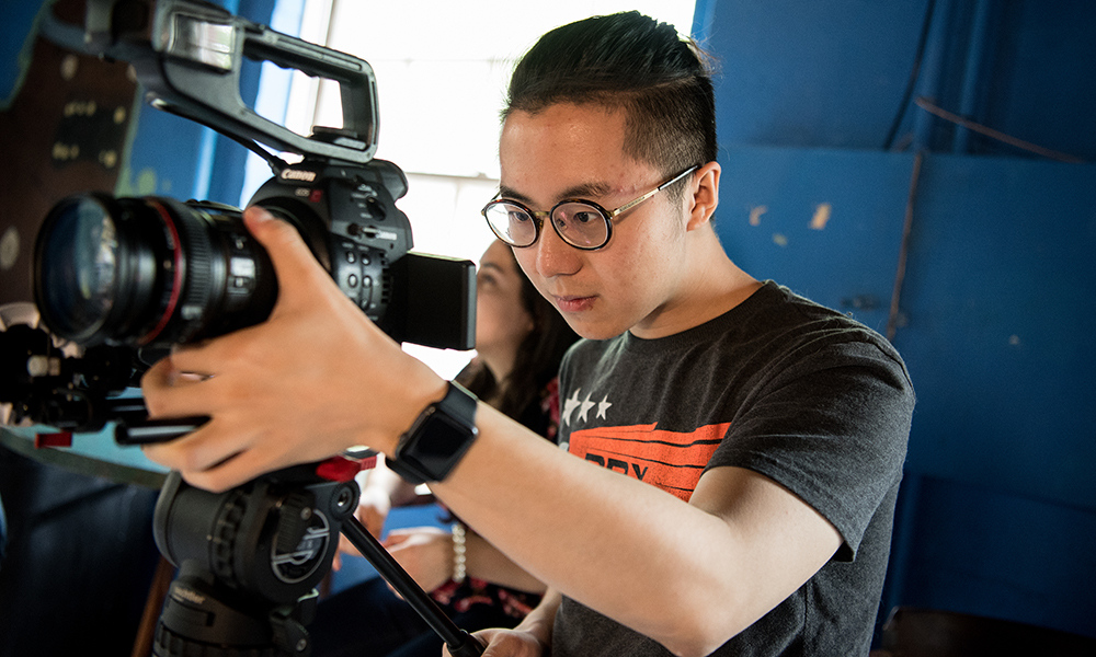 Student with video camera