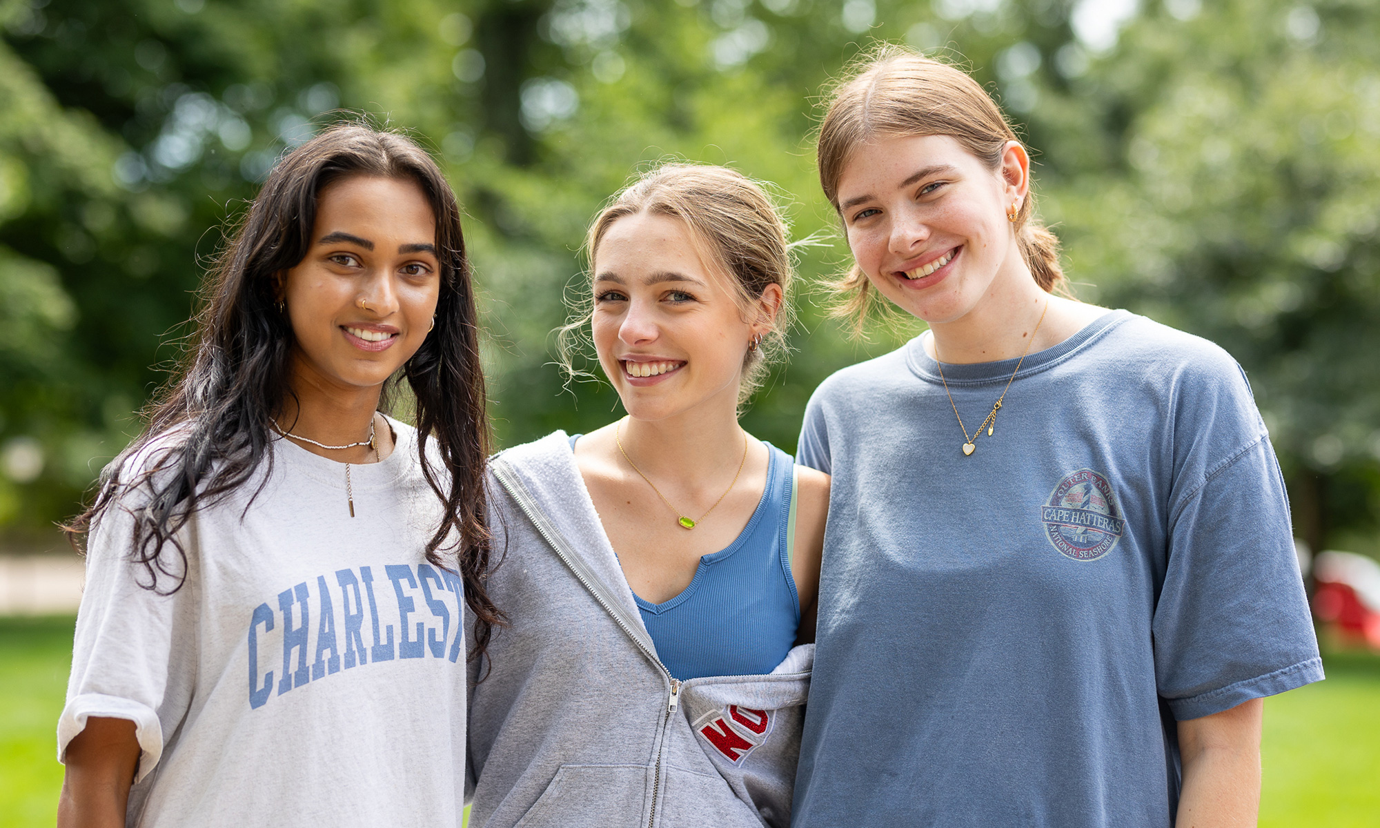 Three students posing for a group photo