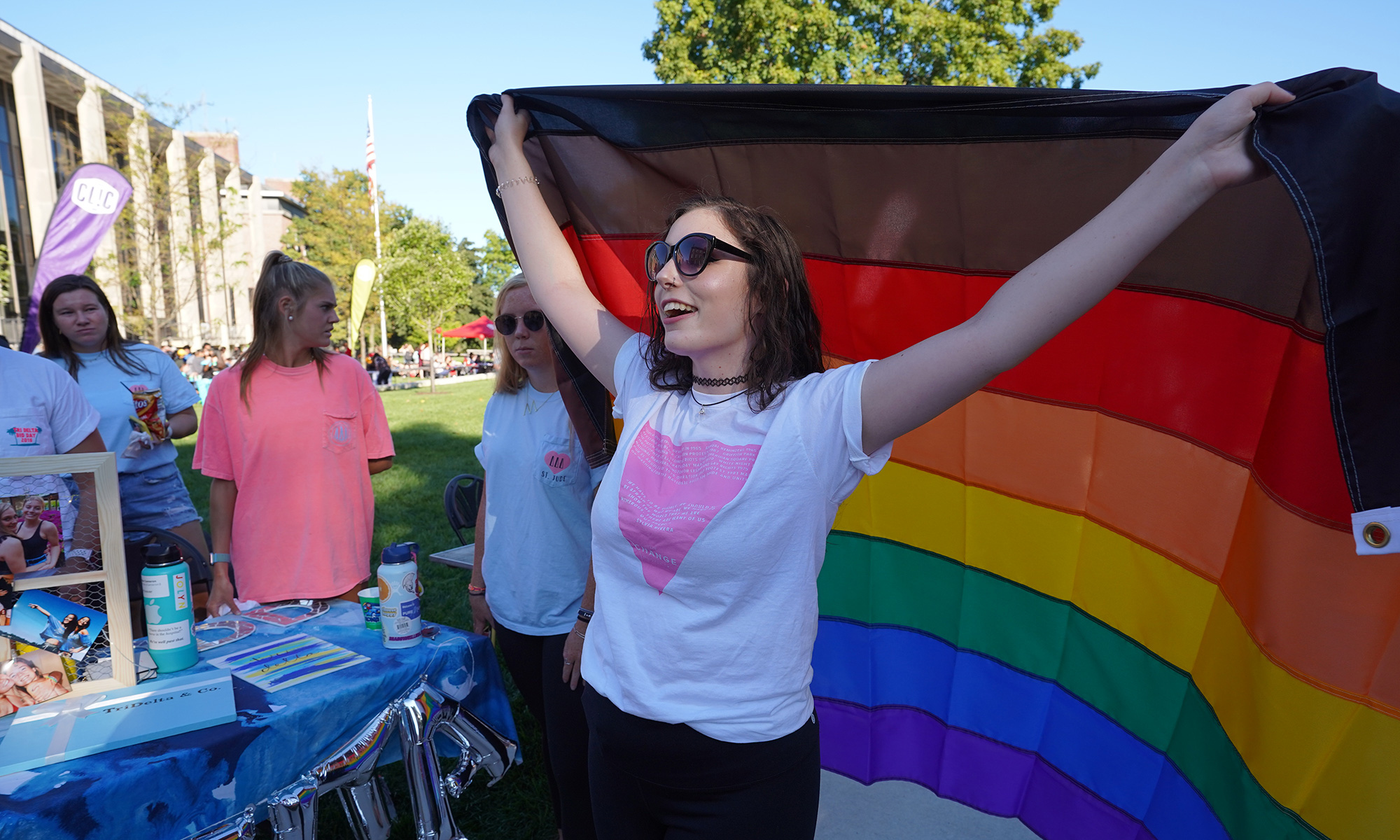 Student holding a pride flag