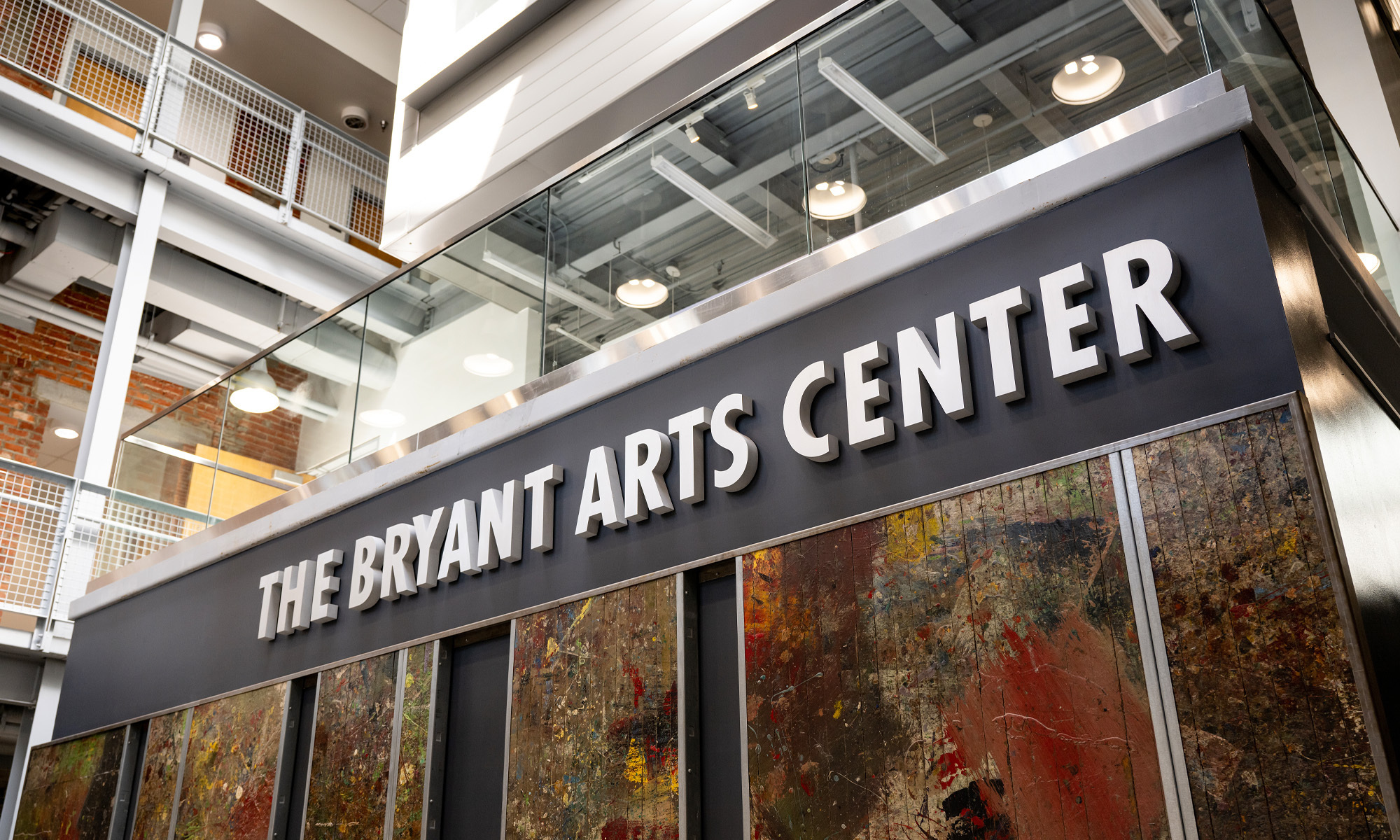 Interior photo of Bryant Arts Center lobby and sign