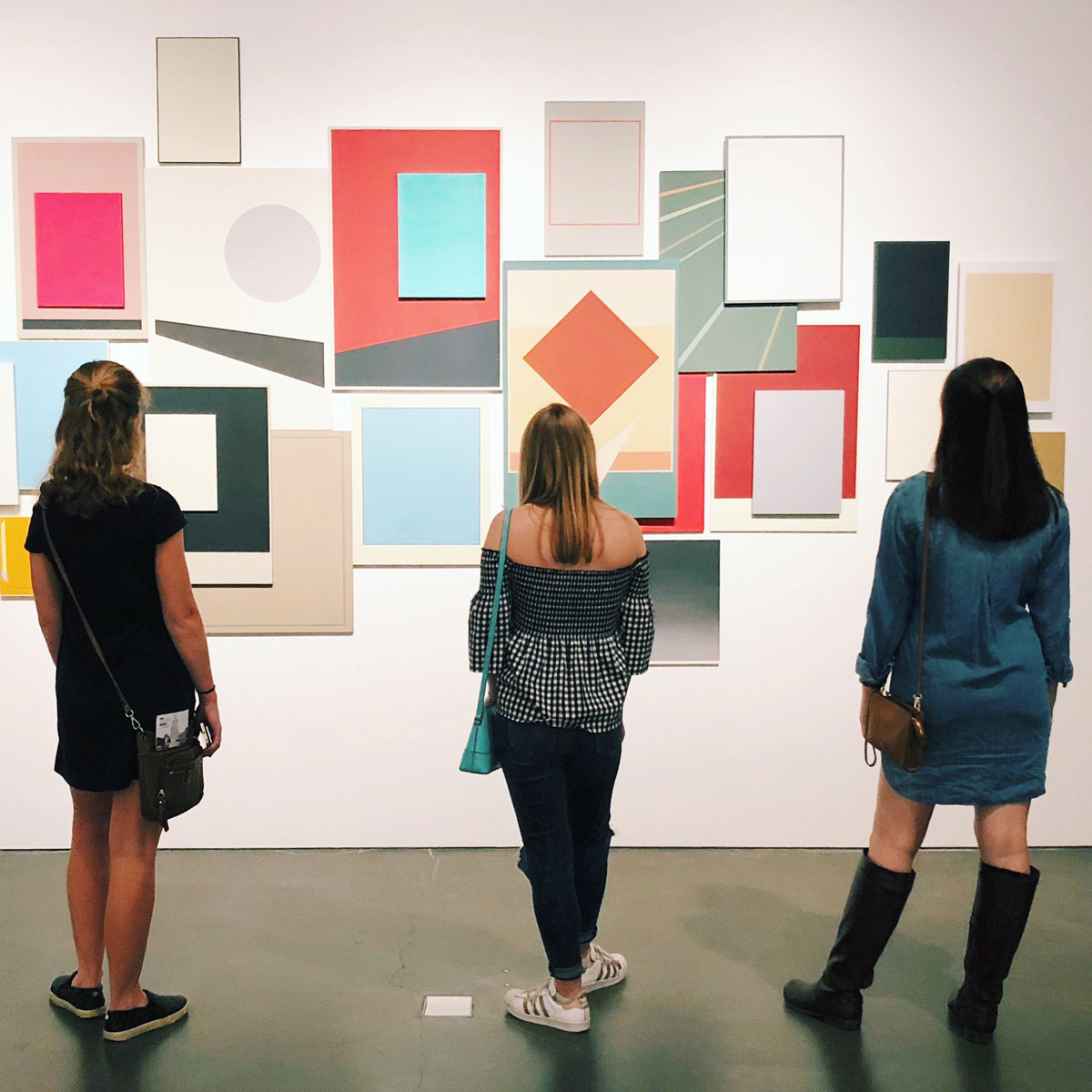Students looking at art in a museum