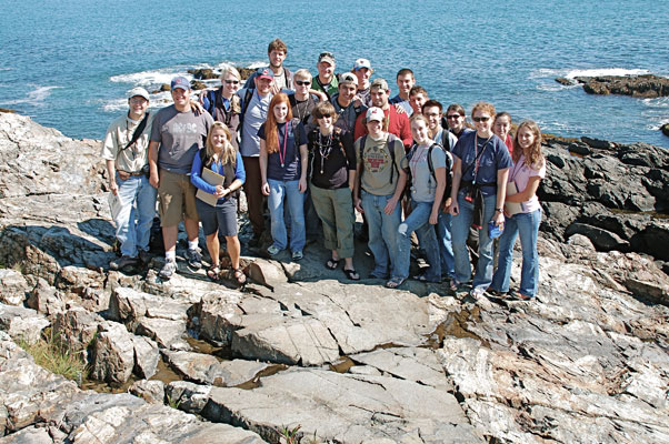 The crew standing on a mafic dike at Ogunquit.