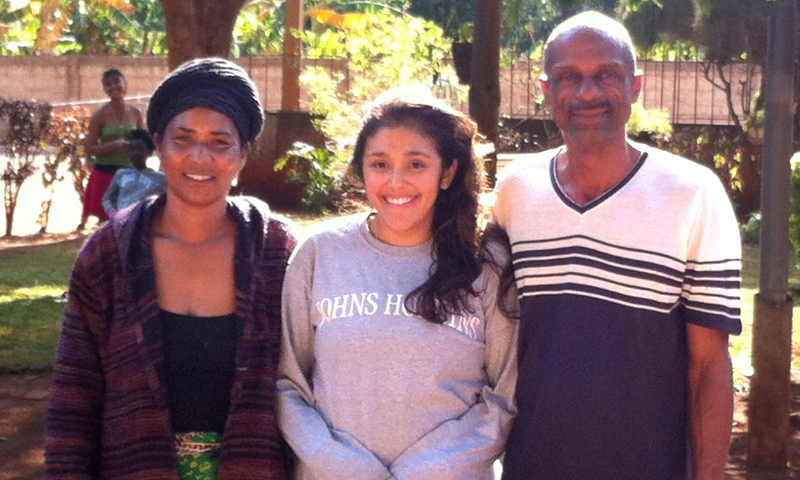 Adela Hoffman '10 with her Peace Corps homestay parents in Mozambique.
