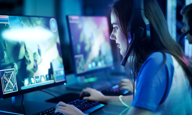 girl gaming on computer