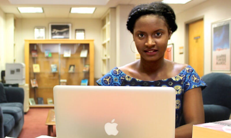 Hali Bah sitting with laptop