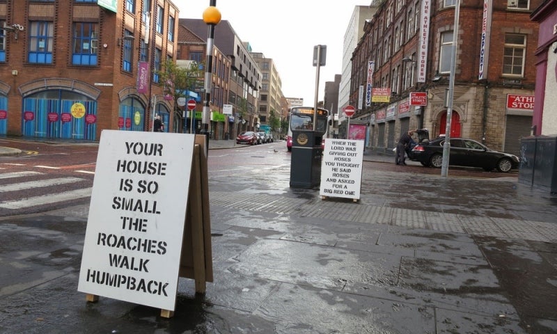 City streets with sidewalk signs