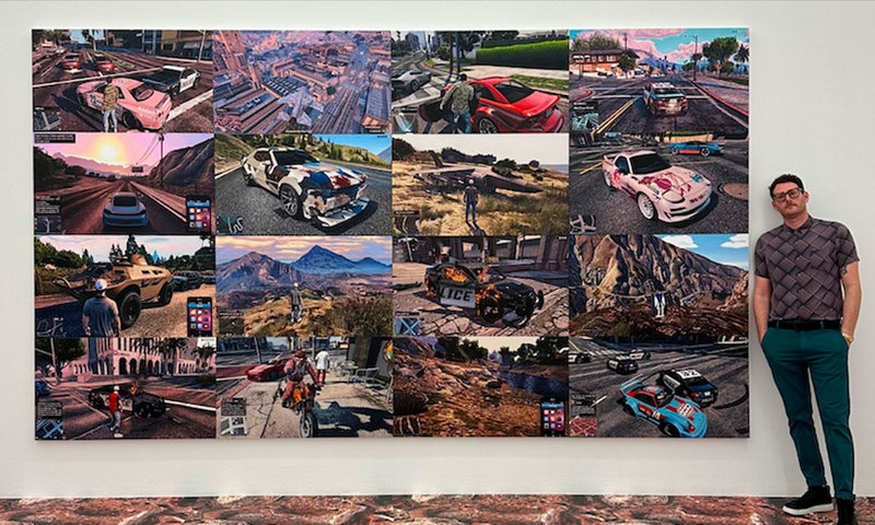 Man standing next to art piece