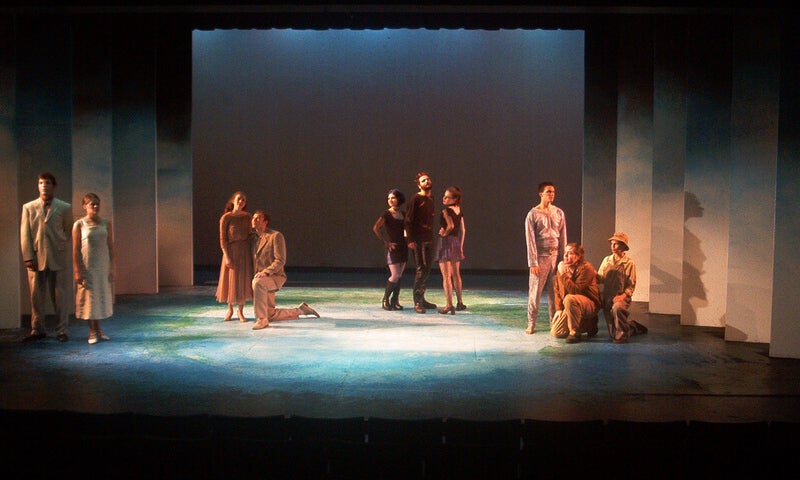 The ensemble of Perdita Gracia pose in vignettes on stage. Hermione and her husband Leo stand together, Florio kneels next to Perdita, the chorus of Ravens pose together, and Frip and Bosco kneel beside Axl.