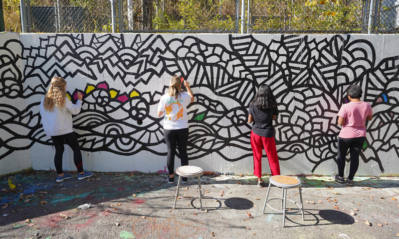 Students creating a mindful graffiti wall